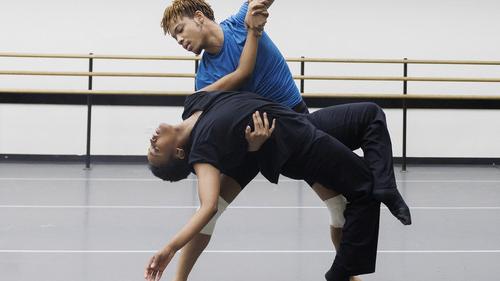 two dancers rehearsing in a studio
